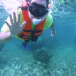 Aaron Douglas waving after snorkeling in Cancun